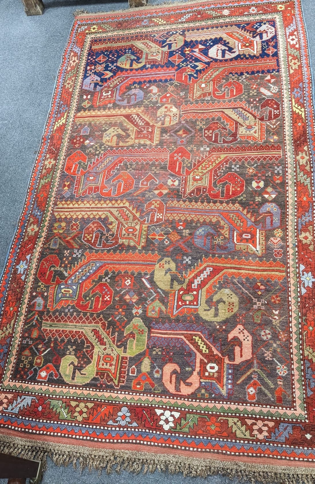 An antique Goradis blue ground rug 220 x 125cm